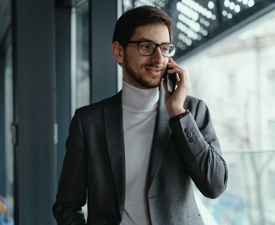 Portrait successful business man talking on the smartphone Portrait successful business man talking on the smartphone